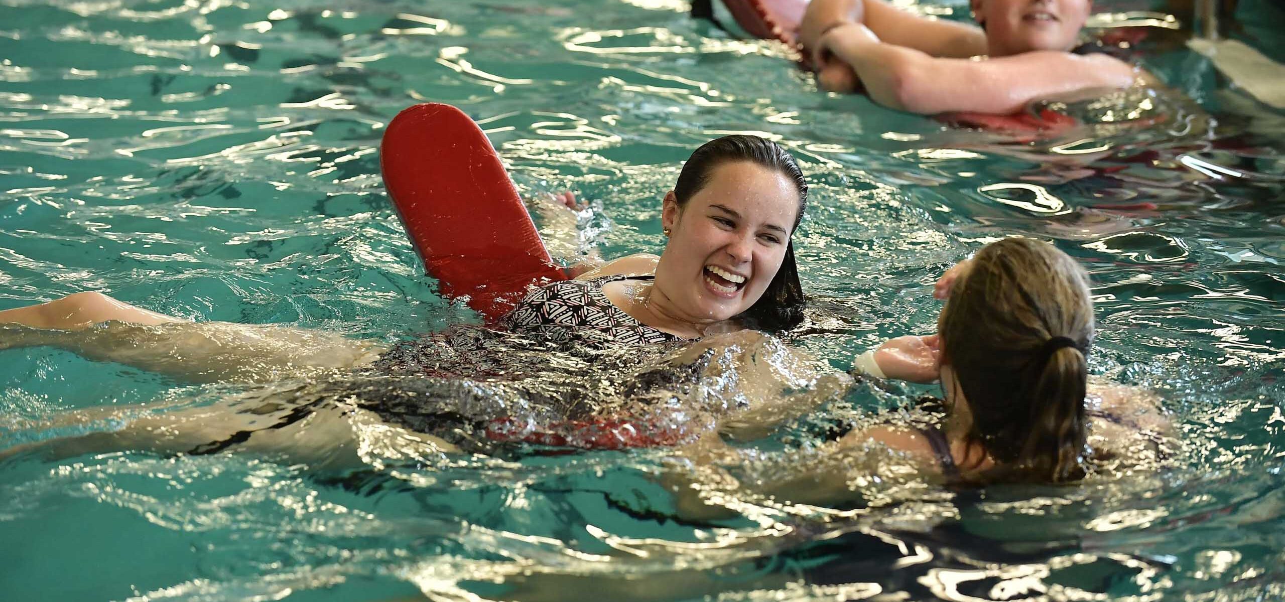 A group of people getting ready to receive lifeguard certification.