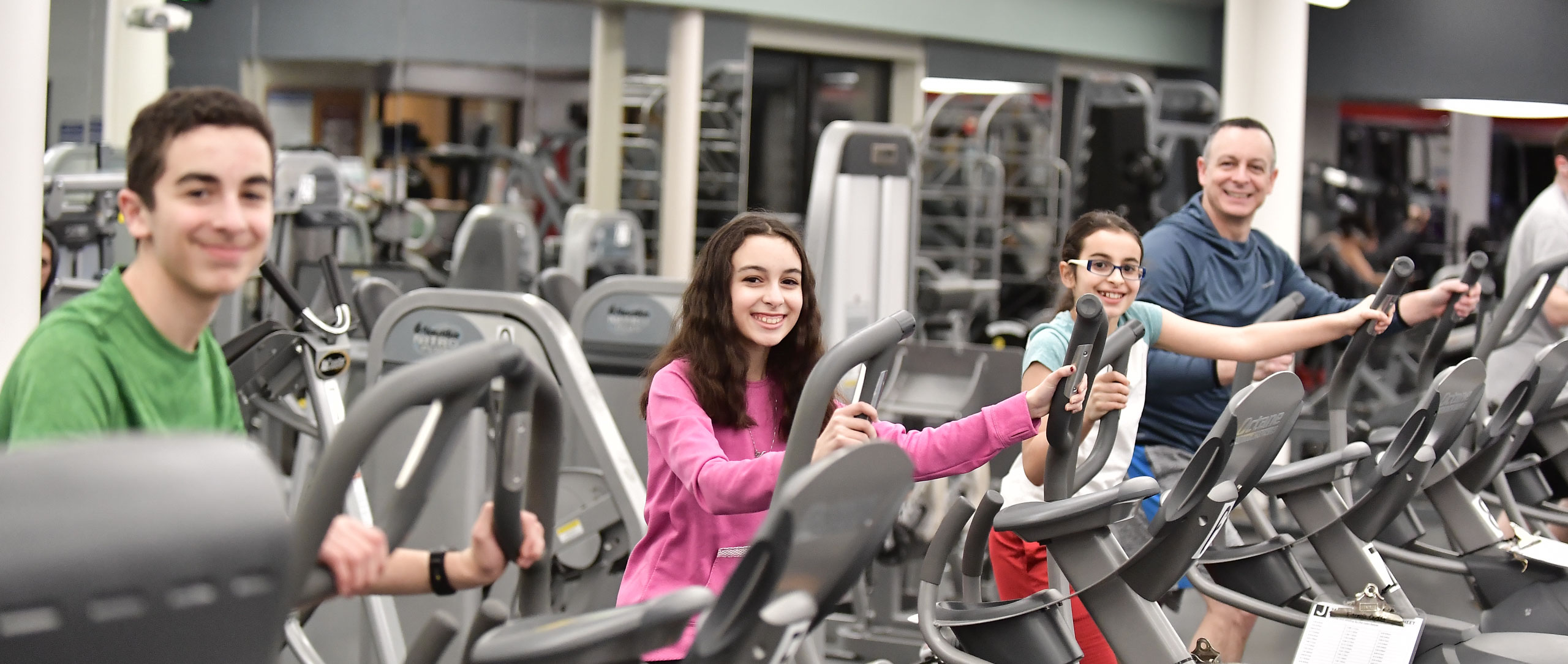 A group of people exercising at a gym together.