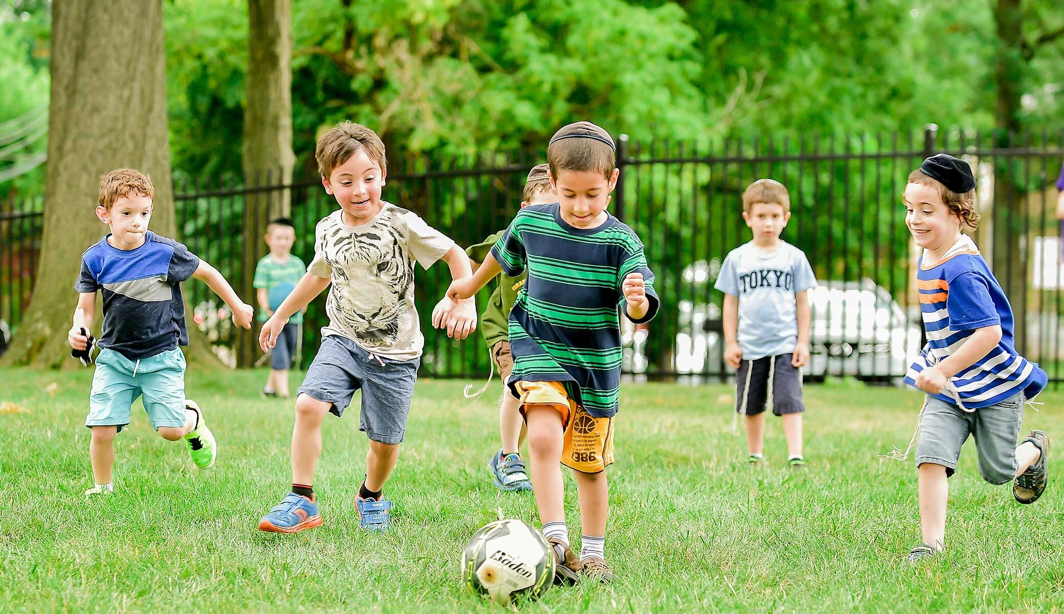 Kids playing soccer.