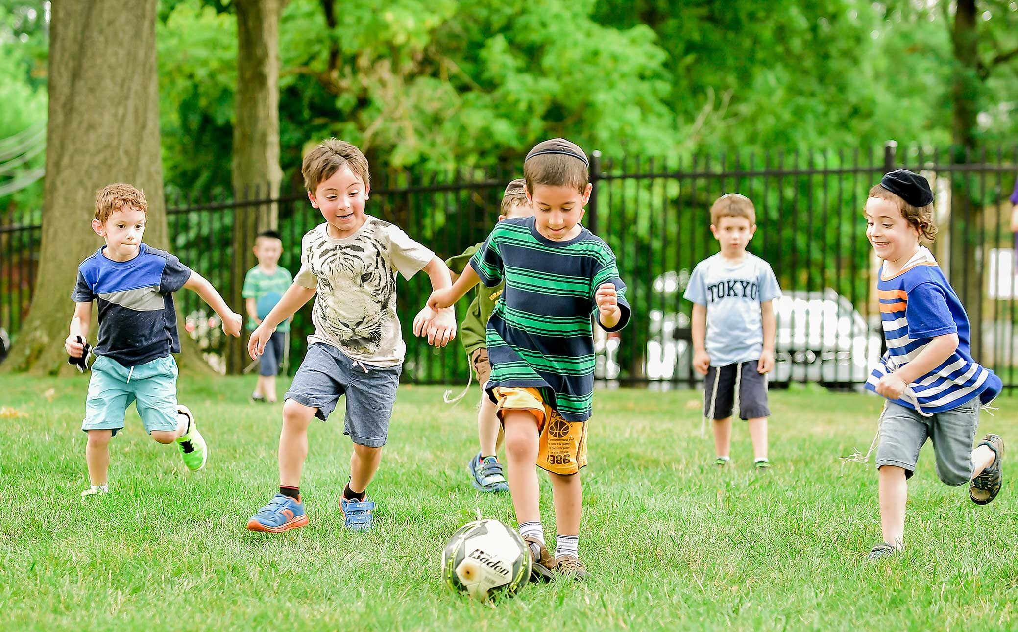 Kids playing soccer.