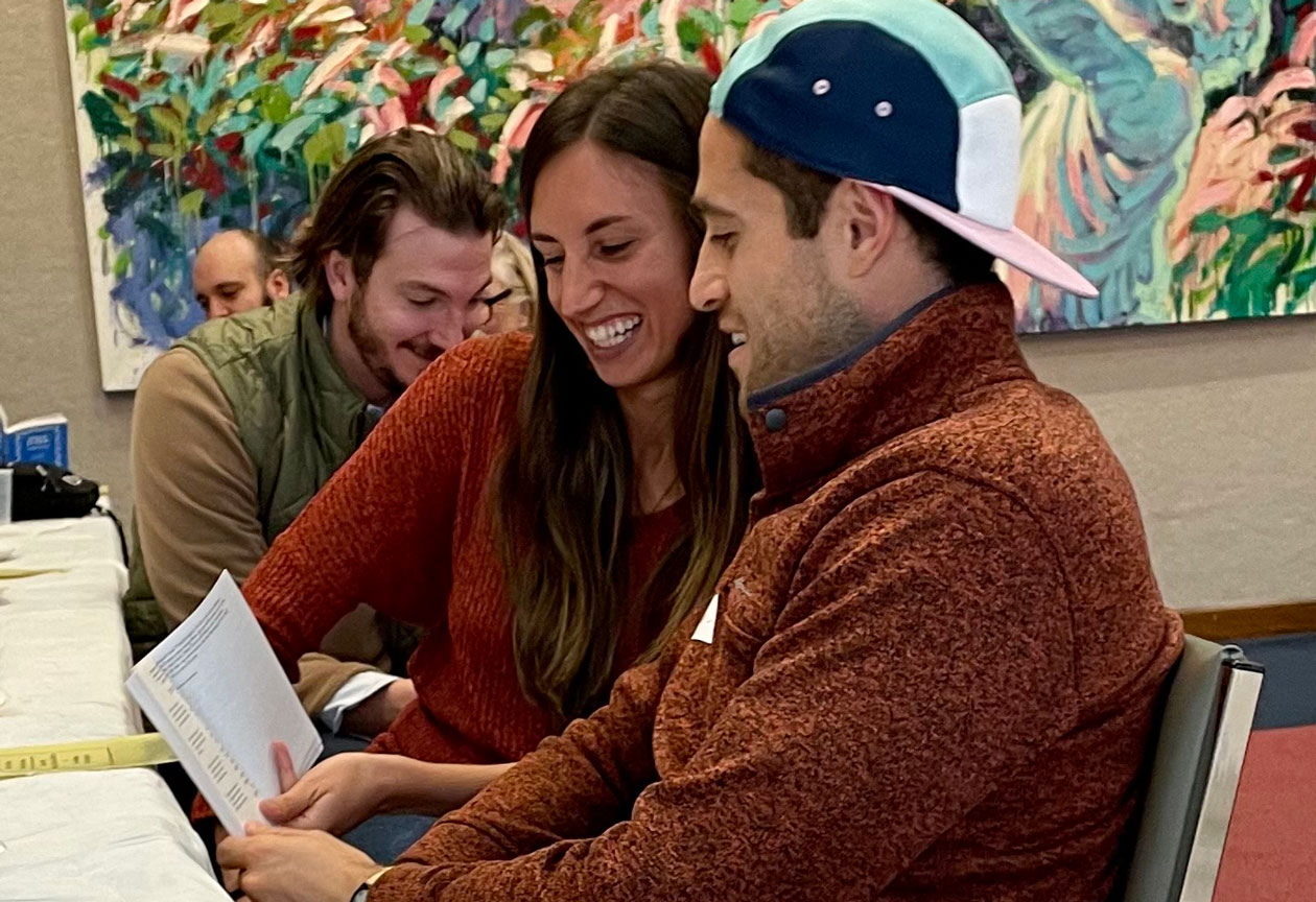intro to judaism couple reading at group shabbat