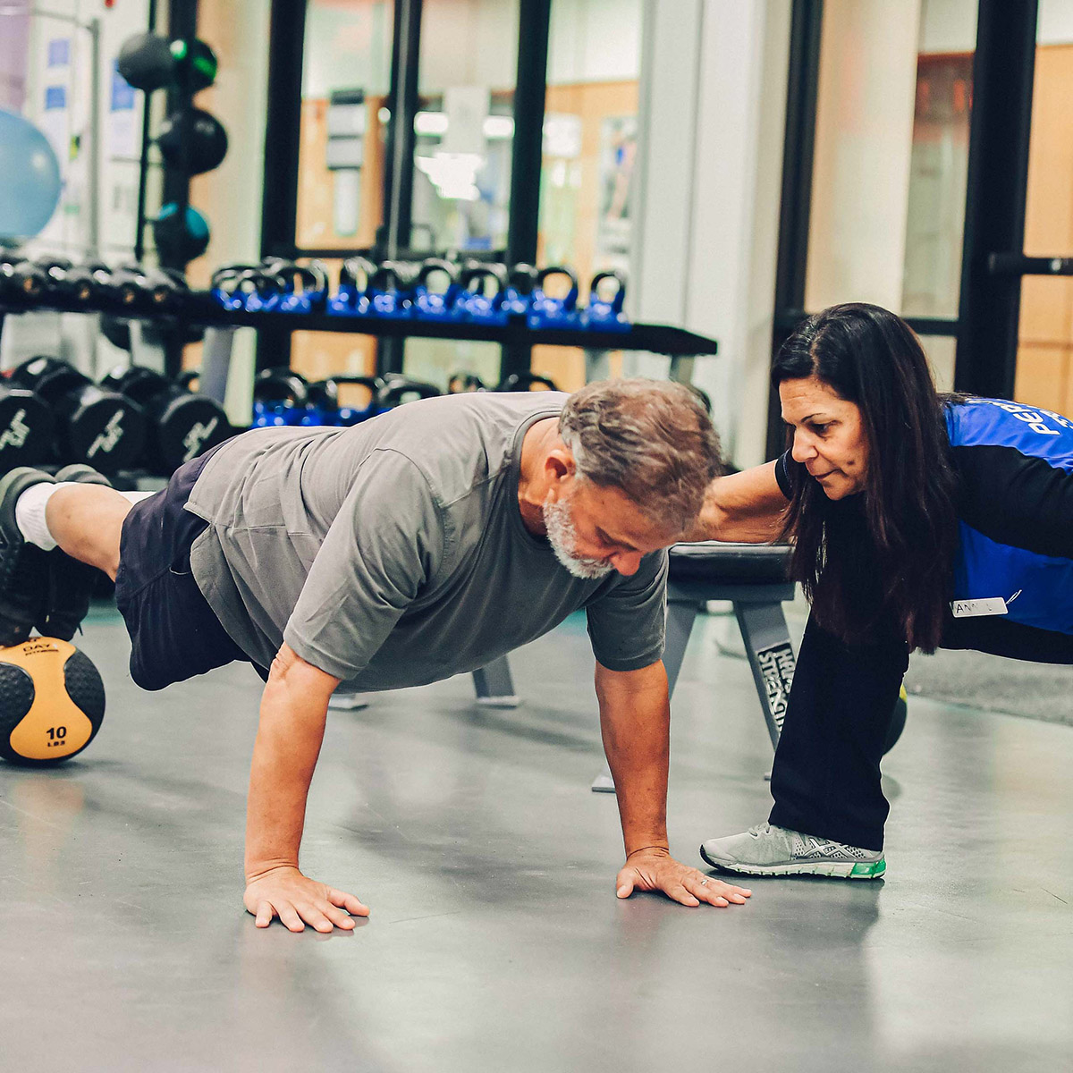 A man receiving personal training.