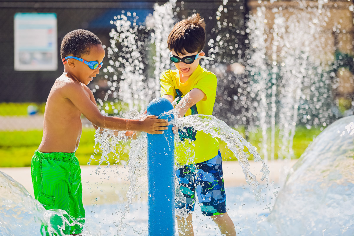 Kids playing at a splashpad.