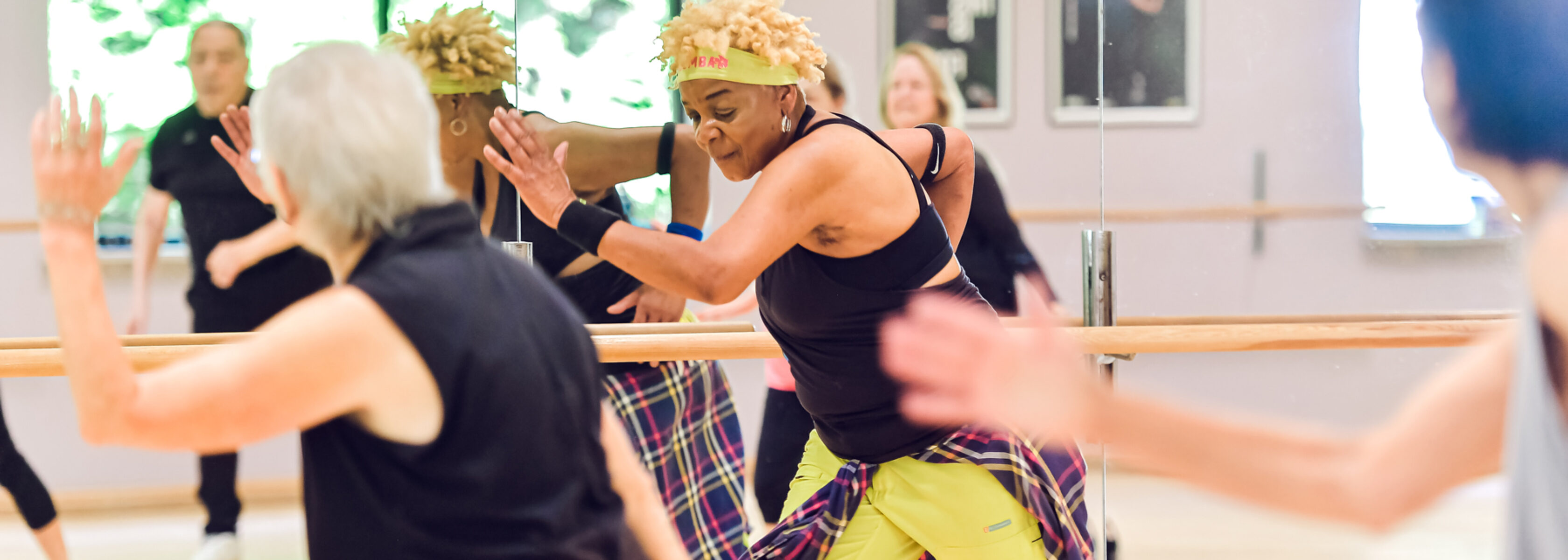 group of women taking a group fitness class