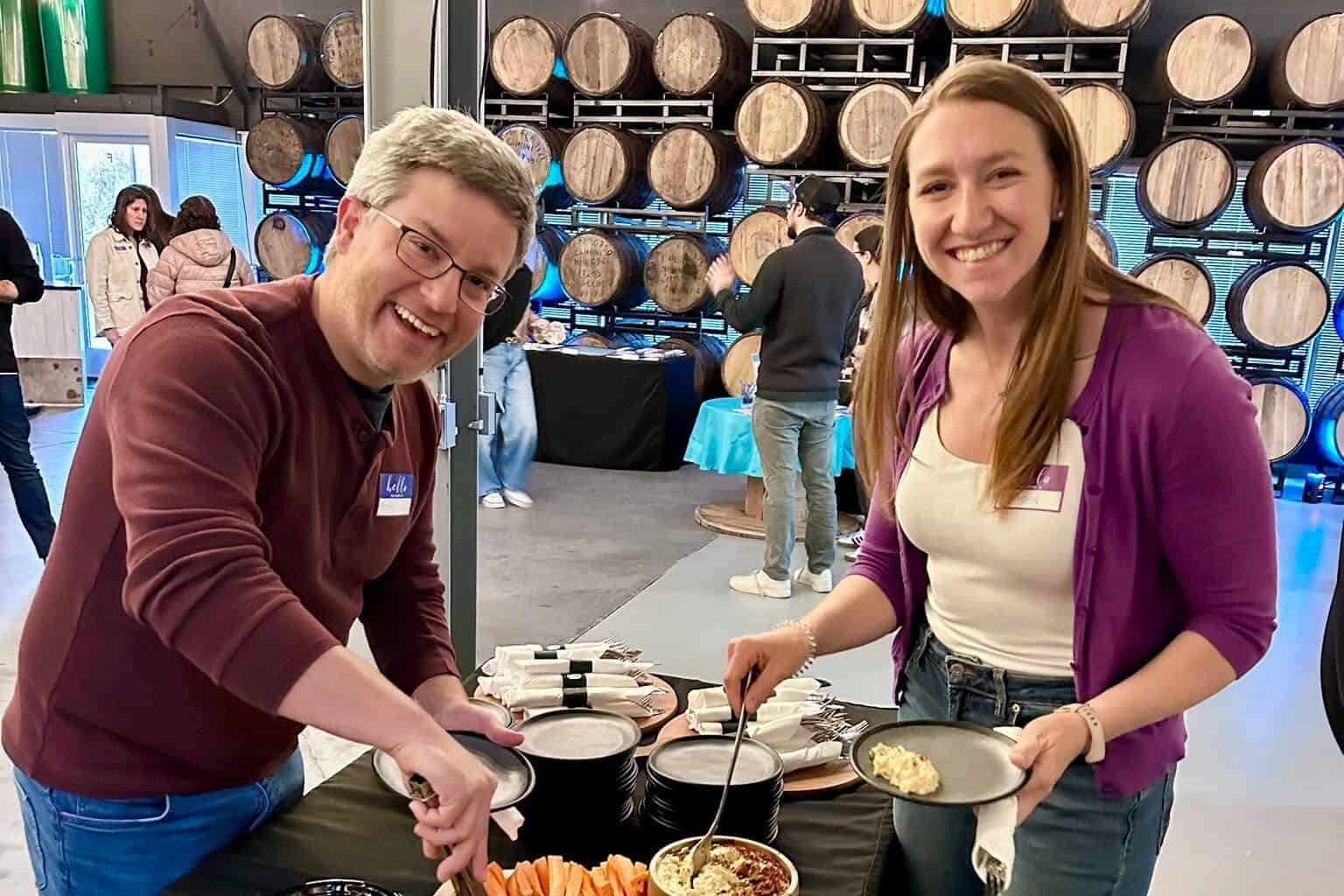 Man & woman smiling at buffet