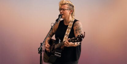 Shannon Smith singing and playing guitar