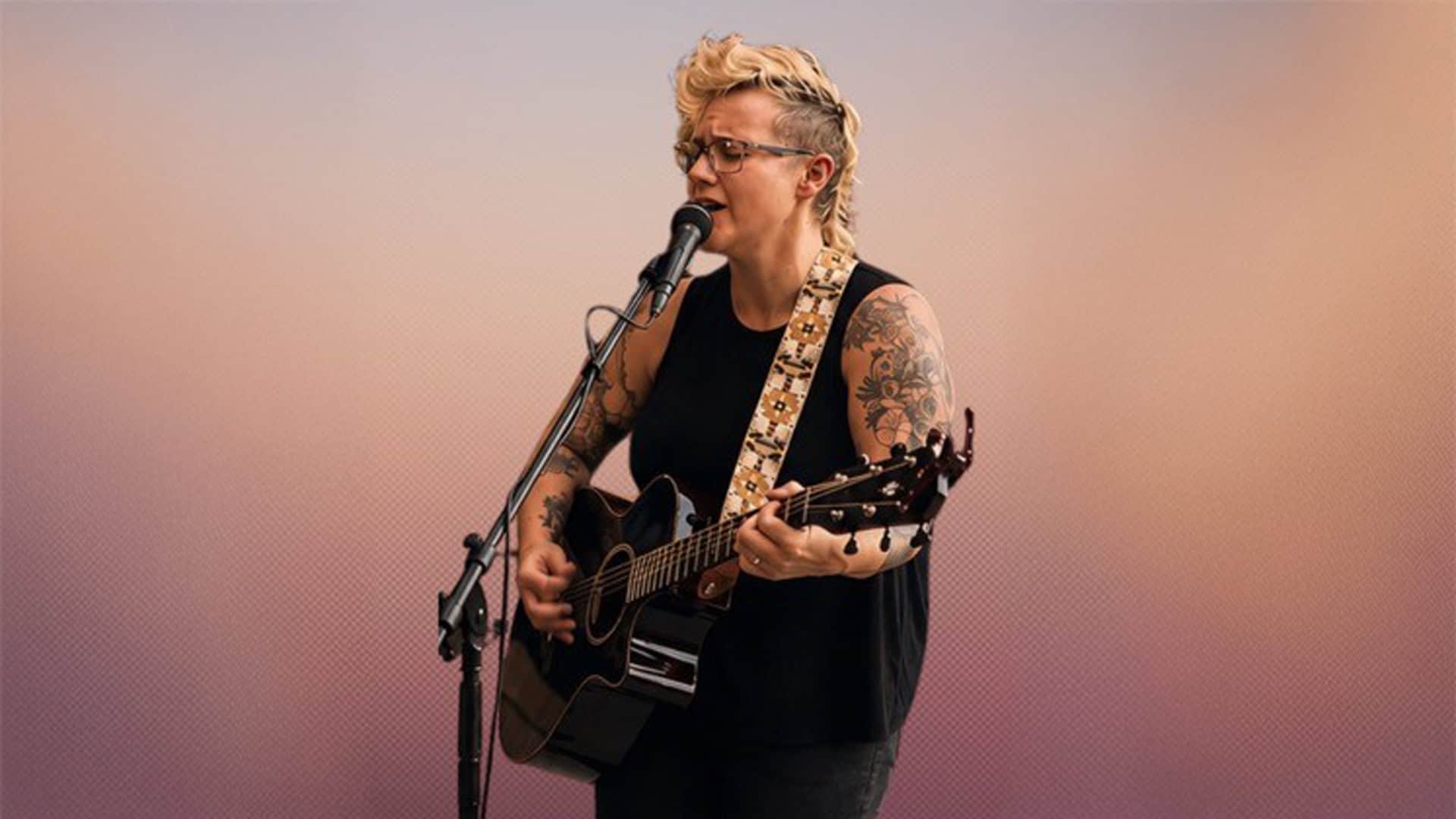 Shannon Smith singing and playing guitar